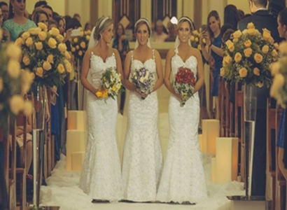 Identical triplets Rafaela Bini, Rocheli Bini and Tagiane Bini got married to their respective husbands together at Catedral Nossa Senhora Aparecida in Passo Fundo, Brazil, March 21, 2015.