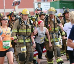 Midwest City Firefighters Caleb Bryant and Garret Matlock helped a woman finish the latter part of the half marathon