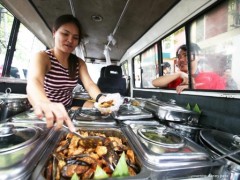 woman converts her van into a carinderia selling affordable meal packages along Padre Faura Street in Manila on Saturday May 16, 2015